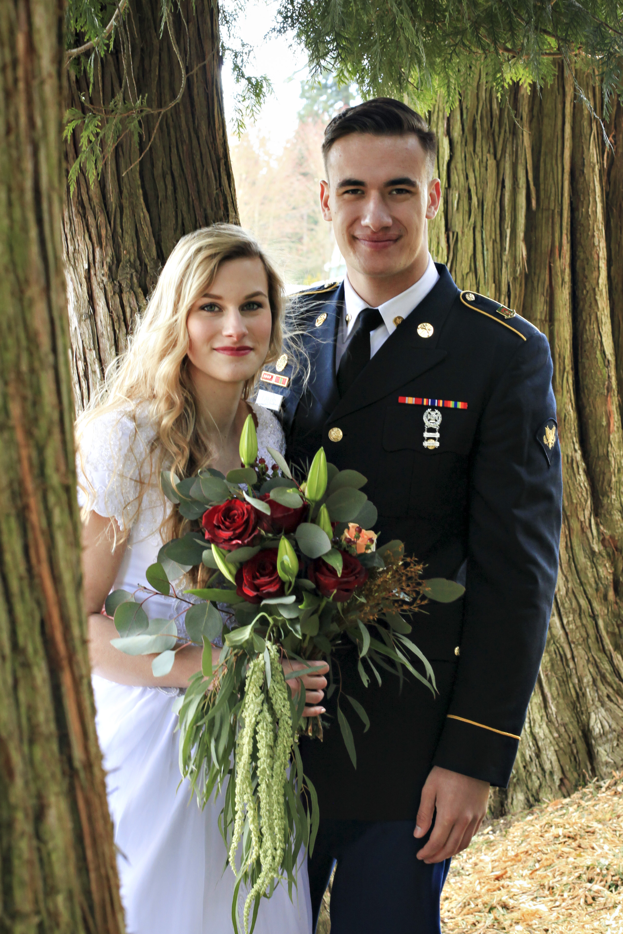 Beautiful couple in trees at the Barn at Holly Farm