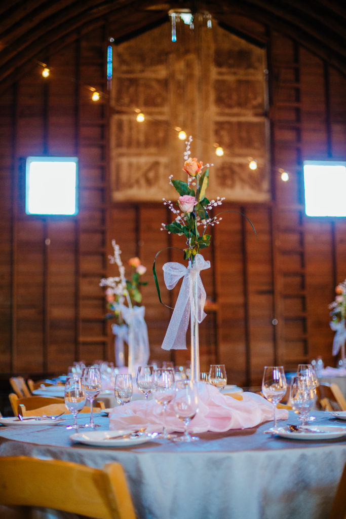 Classic rose arrangement on a wedding guest's table