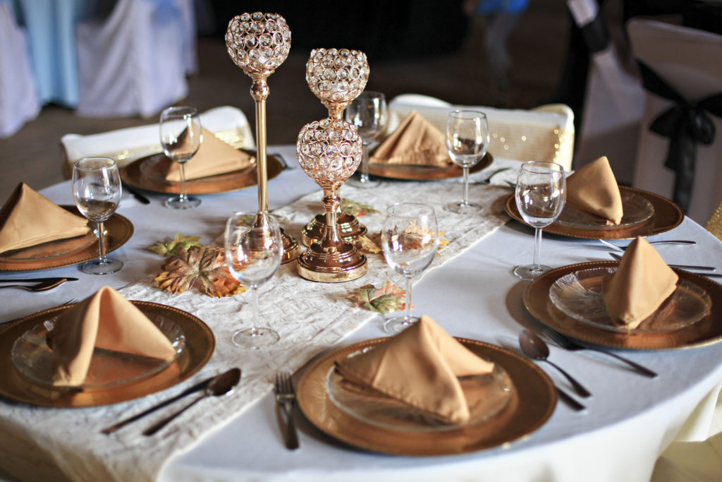 Elegant gold themed wedding table setting